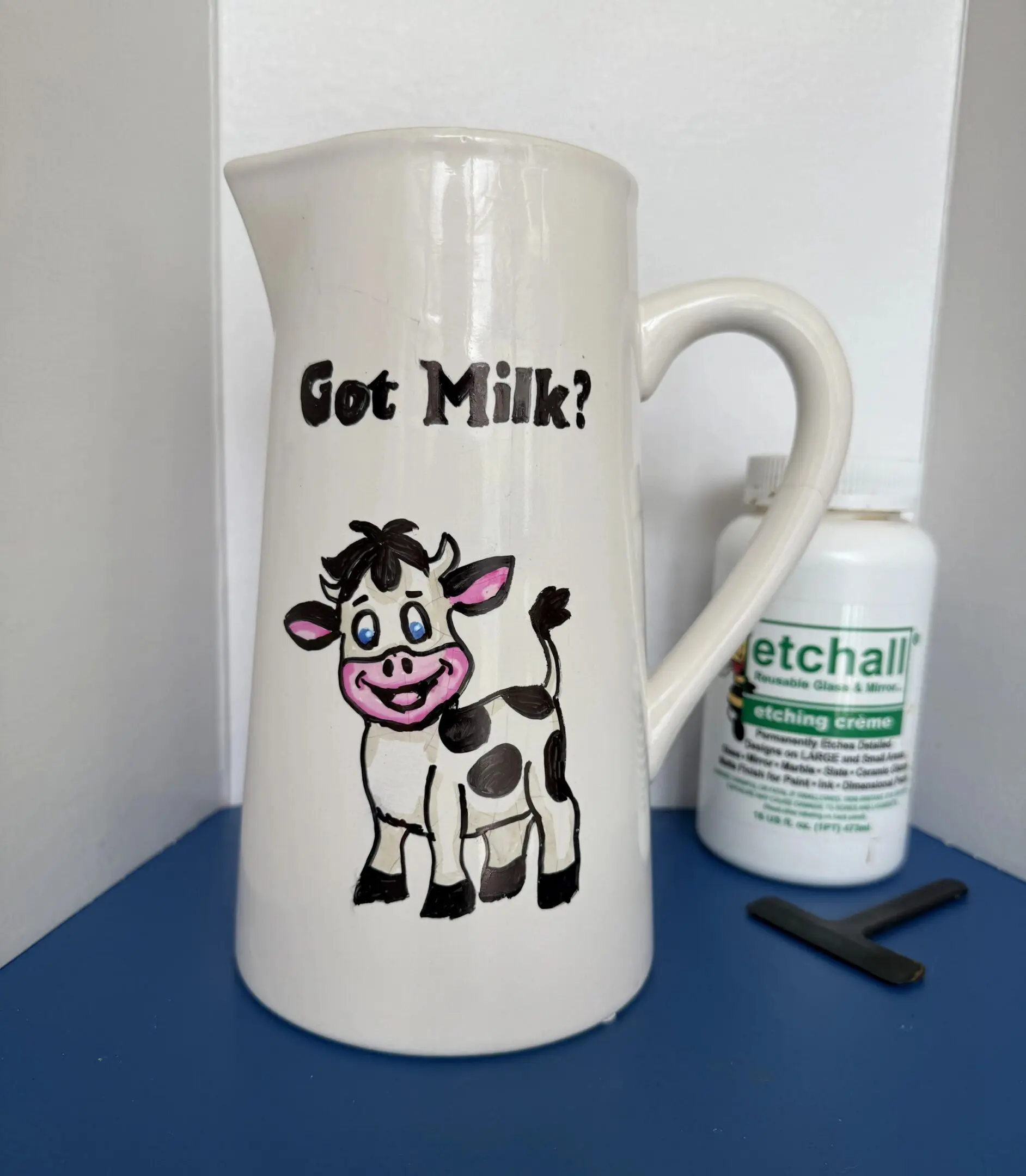 Ceramic jug with cow illustration