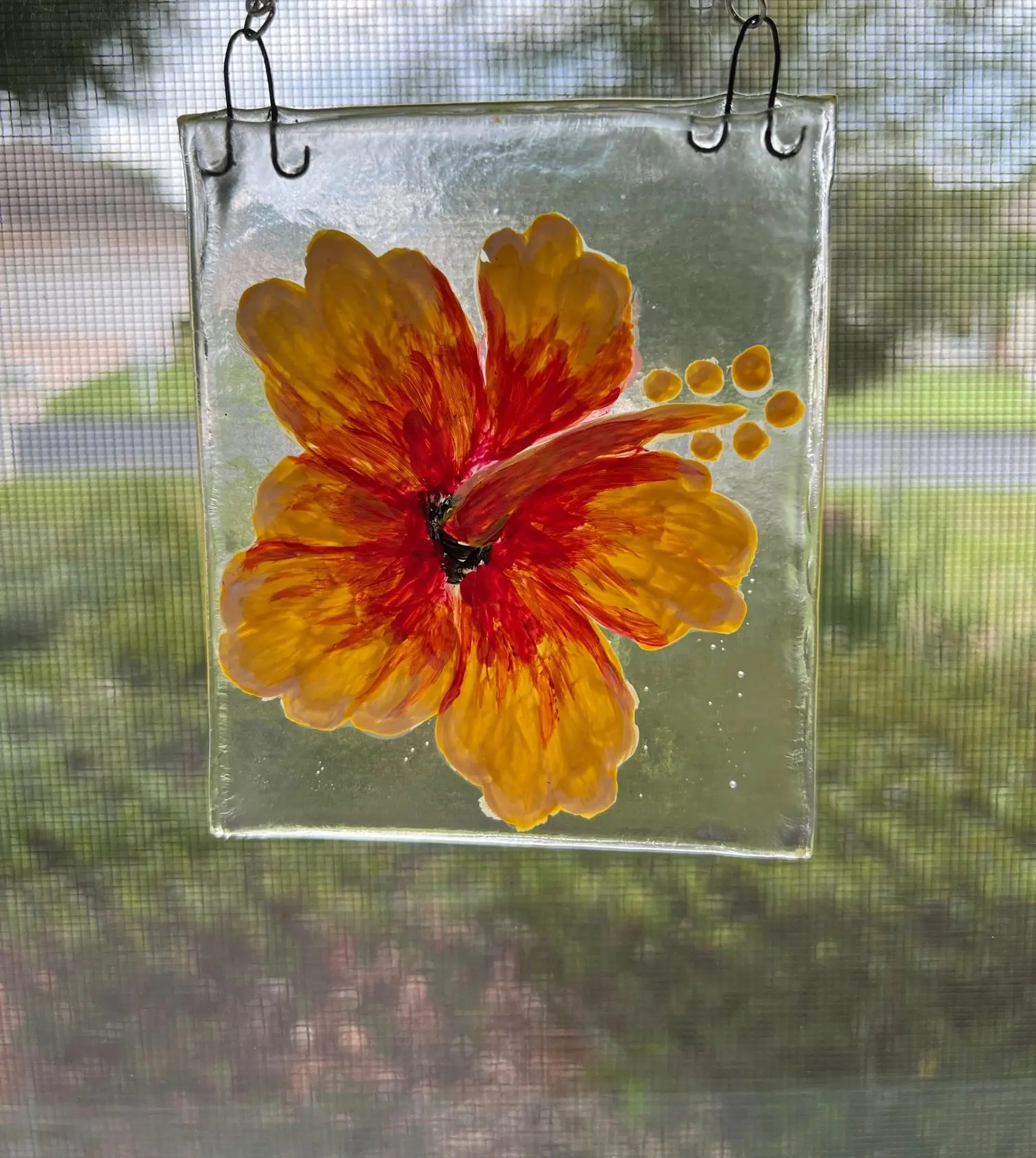Sunlit floral glass art hanging