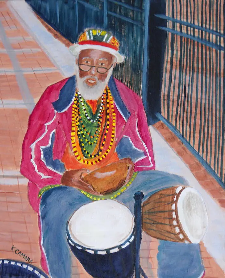 Colorful street musician playing hand drums