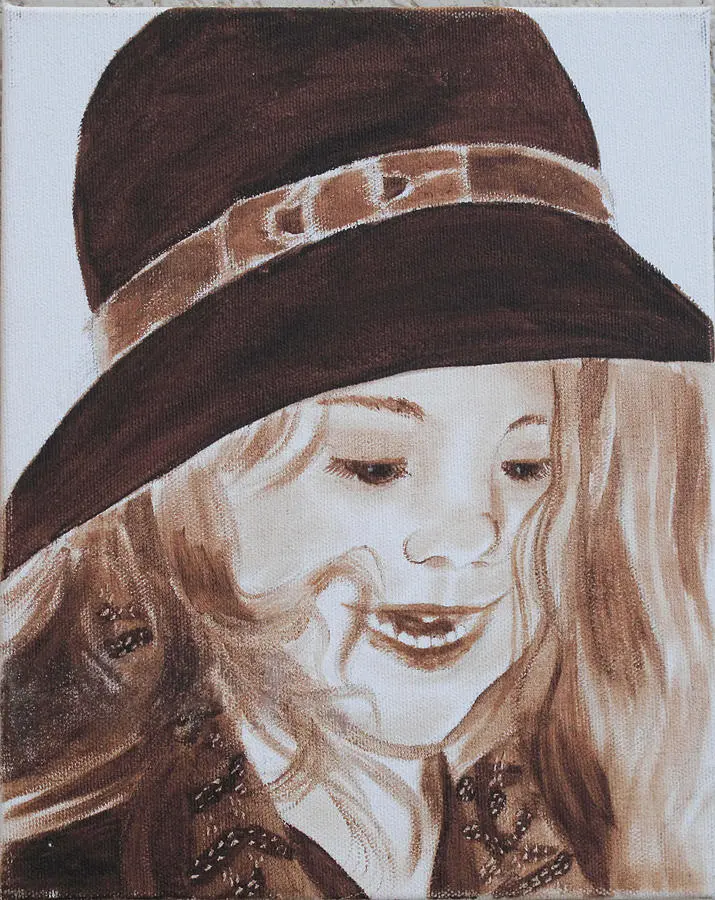 Sepia portrait of smiling girl wearing hat