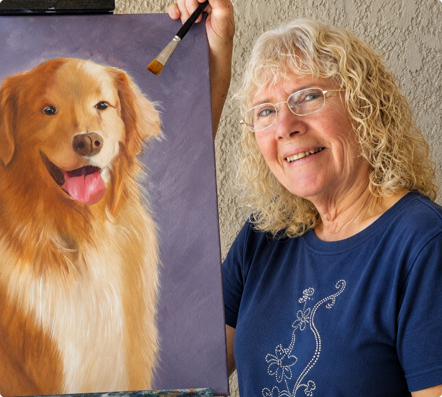 Artist holding dog portrait