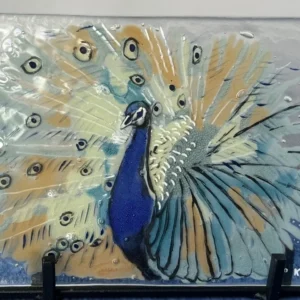 Fused glass peacock with fanned tail